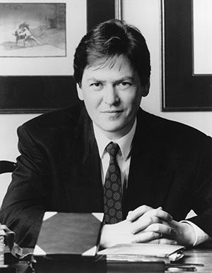 man in suit at desk